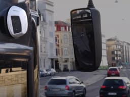 AXIS P3925-LRE from AXIS COMMUNICATIONS - Network Camera placed on the side of a bus driving in Malmö City.