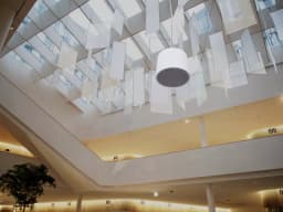 AXIS C1510 from AXIS COMMUNICATIONS - Network Pendant Speaker, mounted in the ceiling in an office building